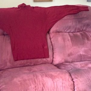 Long sleeved fine wool sweater with turtleneck.